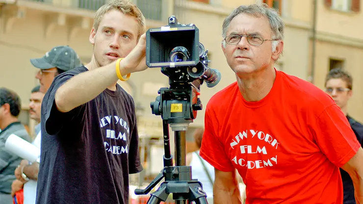 Students learning filmmaking techniques with a professional camera during an English plus filmmaking program.