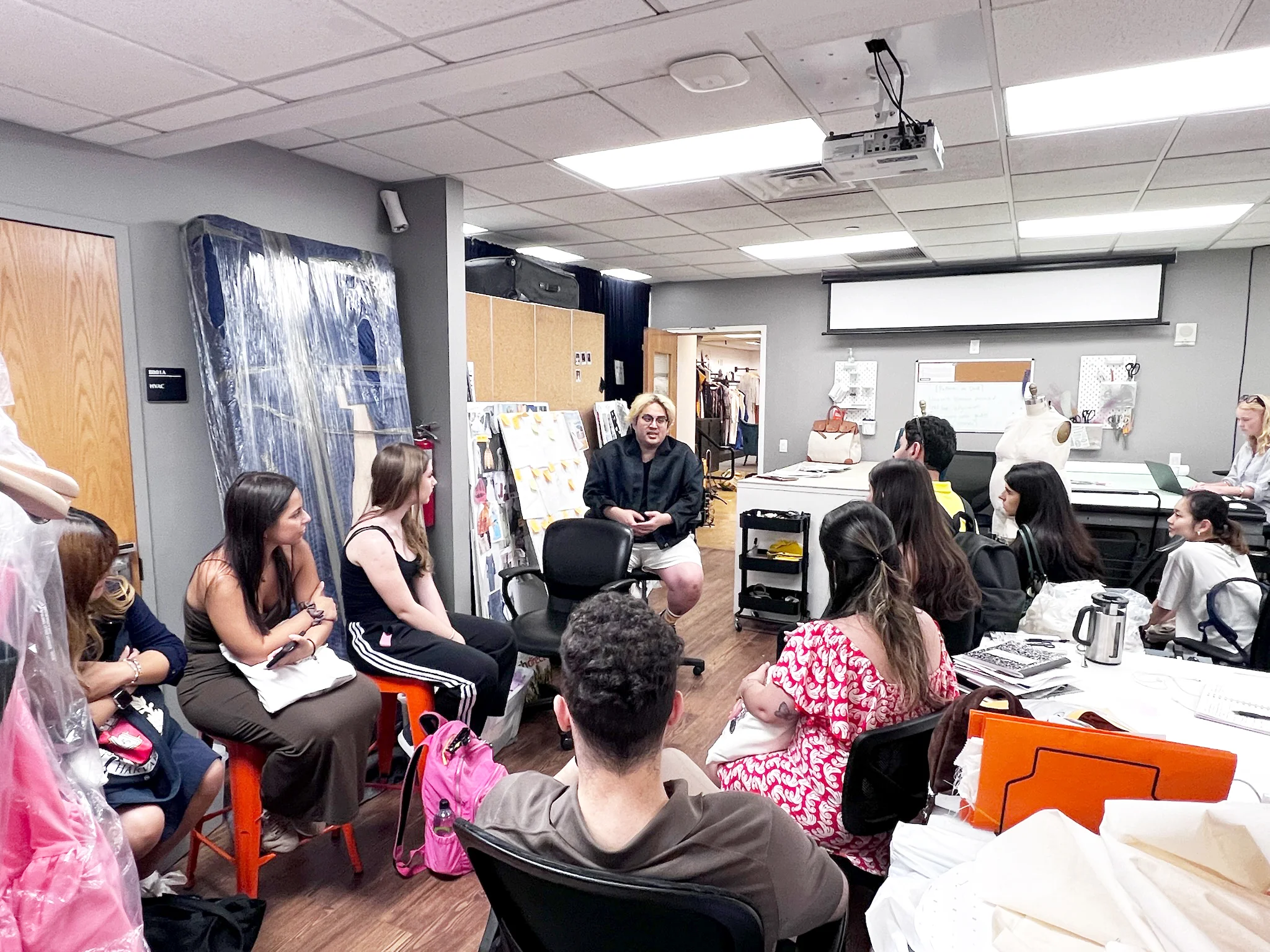 fashion program students with acclaimed fashion designer Bach Mai